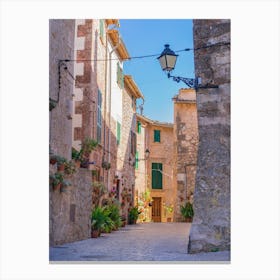 Romantic street in the old village of Valldemossa on Mallorca, Spain Balearic islands. Lose yourself in the idyllic old village of Valldemossa on Mallorca, Spain Balearic islands. This romantic street is a famous landmark that depicts the rich history and Mediterranean culture of the town. Canvas Print