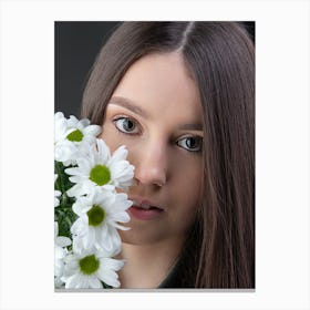Portrait Of A Young Woman With A Flower Canvas Print