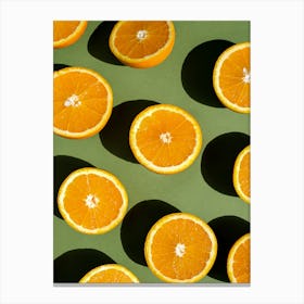 Orange Slices On Green Background Canvas Print