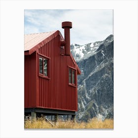 Little red hut in the mountains Canvas Print