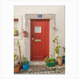 The red door nr. 25 in Alfama, Lisbon, Portugal - summer street and travel photography by Christa Stroo Photography Canvas Print