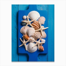 Sea Shells On A Blue Cutting Board Canvas Print