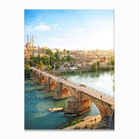 Ottoman Footbridge Arching Gracefully Over A Serene River Ancient Town Sprawling Hillside With Cobb Canvas Print