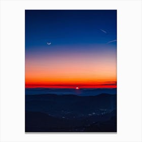 A Sweeping Panorama Of An Evening Sky Blood Red With The Setting Sun Transitions Into A Serene Moon (4) Canvas Print