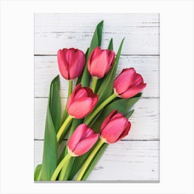 Red Tulips On A Wooden Background Canvas Print