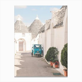 Puglia, Italy I Quiet street in Alberobello white village with trulli architecture and Vespa scooter in a retro vintage summer pastel aesthetic photography for living la dolce vita in the Mediterranean place Canvas Print