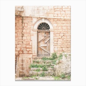 Puglia, Italy I Forbidden door in abandoned destroy wood of authentic architectural urbex building photography to the retro vintage pastel orange aesthetic of a Mediterranean countryside village in Baroque period Canvas Print