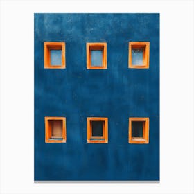 Blue Wall With Orange Windows Canvas Print