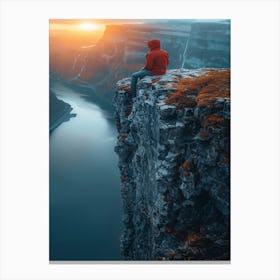 Man Sitting On Cliff At Sunset Canvas Print