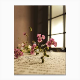 Flowers On A Book Canvas Print