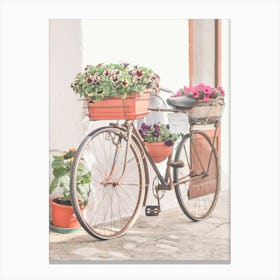 Puglia, Italy I Vintage retro bike with wild flowers photography in the Ostuni village in italian countryside in the atmosphere of Mediterranean sunshine light to the pastel summer aesthetic of La Dolce Vita Canvas Print