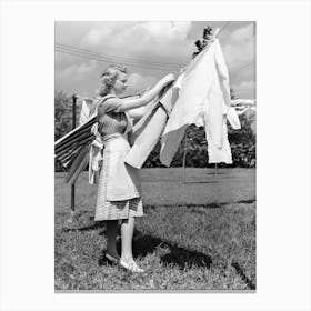 Lady Hanging Laundry on Clothesline, Vintage Black and White Old Photo Canvas Print