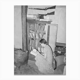 Wife Of Farmer At Her Bookcase In Her Log Home, Pie Town, New Mexico By Russell Lee Canvas Print
