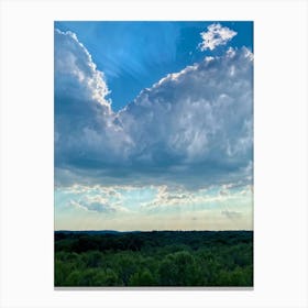 Cumulus Clouds Dominating A Spring Landscape Sunlight Peeks Through The Overcast Sky Casting A Mos (4) Canvas Print