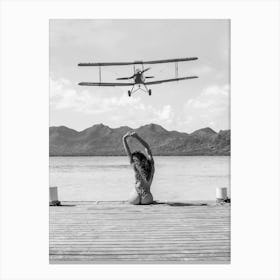 Woman on a Dock - Aircraft Coming In For An Island Landing Canvas Print