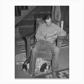 Manager Of The Navajo Lodge Working A Crossword Puzzle With His Dog At His Feet Datil, New Mexico By Russell Lee Canvas Print