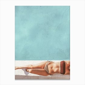 Woman Sunbathing At The Swimming Pool Canvas Print