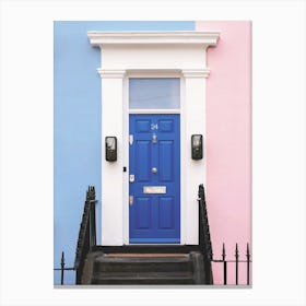 London, England I Emblematic blue door of pastel house in Notting Hill with its pink and blue façade to classic Victorian minimalist geometric colorful londoner architecture photography of an urban street cityscape Canvas Print