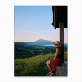 Woman Exuding A Sense Of Freedom While Sitting On A Wooden Porch Overlooking A Vast Hill And Sky Th (1) Canvas Print