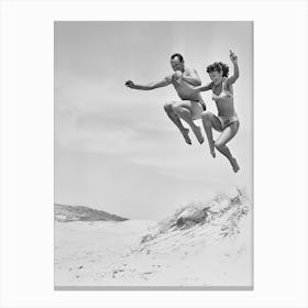 Couple Jumping In The Sand, Vintage Black and White Old Photo Canvas Print