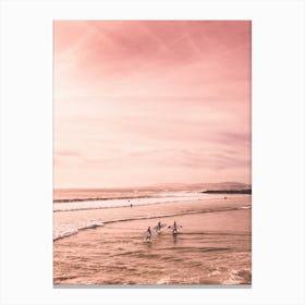 Surfers In Pink Beach Canvas Print