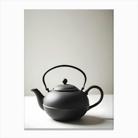 Minimalist Black Teapot With A Round Shape On A White Table And Background Canvas Print