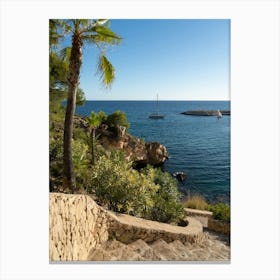 Stone steps lead into a Mediterranean bay Canvas Print