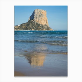 Peñón de Ifach and its reflection on the sandy beach in Calpe Canvas Print
