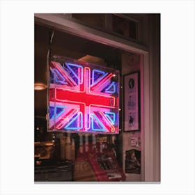 London, England I Neon light of the United Kingdom flag in a moody dark window on a Londoner street to the vibrant cosmopolitan spirit of the English capital with abstract analog film photography Canvas Print