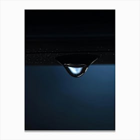 Tear Droplet Poised On The Edge Of A Cheek Cast In Sharp Relief Against A Somber Dark Background C (1) Canvas Print