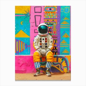 Astronaut Sitting In Front Of Colorful Wall Canvas Print