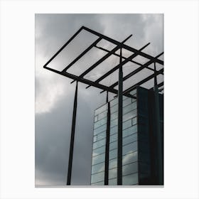 Office Building Against A Cloudy Sky Canvas Print