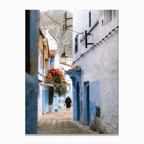 Man Walking  in the blue floral street| Chefchaouen | Morocco Canvas Print