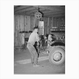 Garage Owner Hoisting Car So That He Can Make Repairs, Pie Town, New Mexico By Russell Lee Canvas Print