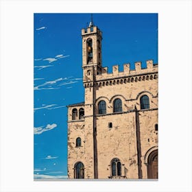 Palazzo dei Consoli (Palace of the Consuls) in Gubbio. A beautifully preserved medieval-style building with intricate stonework and arched windows under a vibrant blue sky. Its towering presence, complete with a clock tower, dominates a sunlit square where visitors stroll and admire the architecture. The scene captures the charm and history of a European town center. 2 Canvas Print