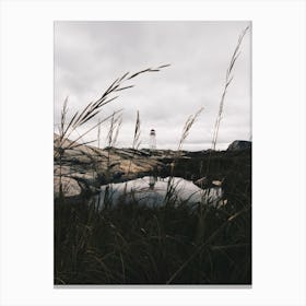 Peggys Cove Lighthouse in Nova Scotia With Pond Mirroring The Lighthouse Canvas Print