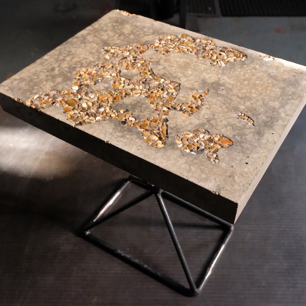 Concrete side table by Kagu Interiors